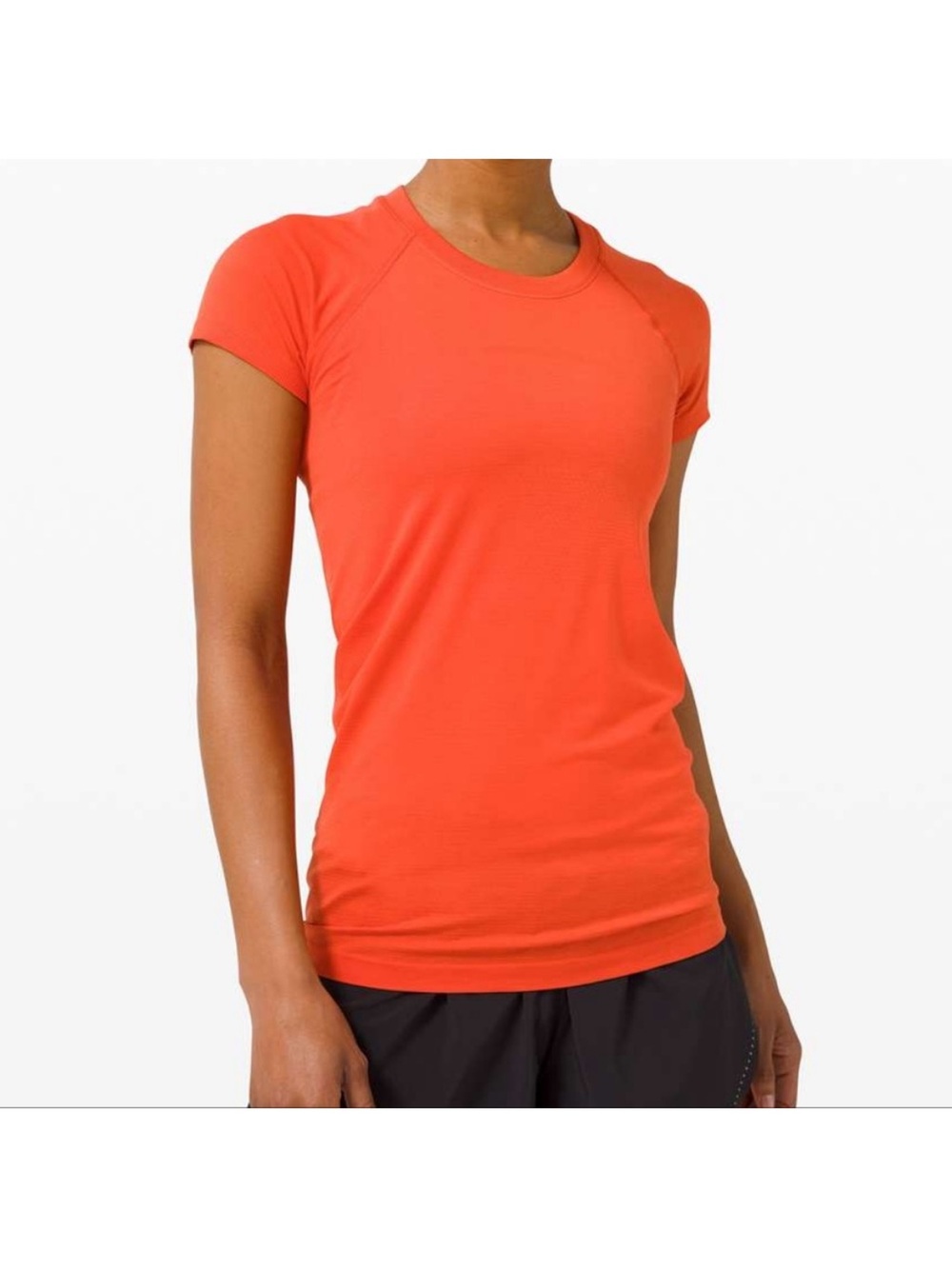 Lululemon Swiftly Tech Short-Sleeve Shirt in an orange color. Womens 10